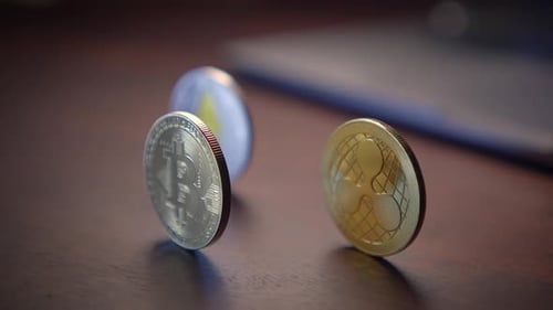 Cryptocurrency Coins: Bitcoin, Ripple, and Ethereum on Desk