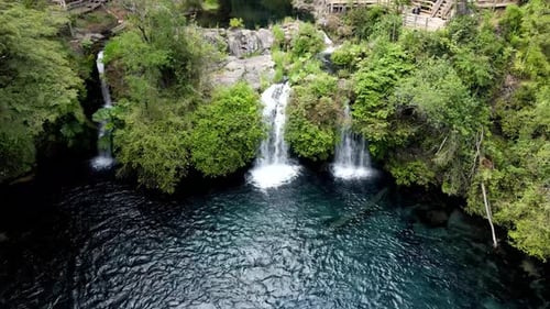 Aerial view of a small waterfall in a forest - drone shot