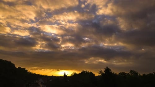 Golden Hour Clouds over a Natural Landscape