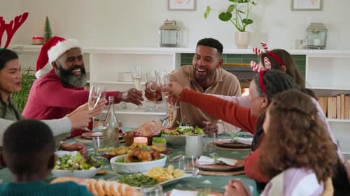 Family Celebrates Christmas Dinner Together at Home