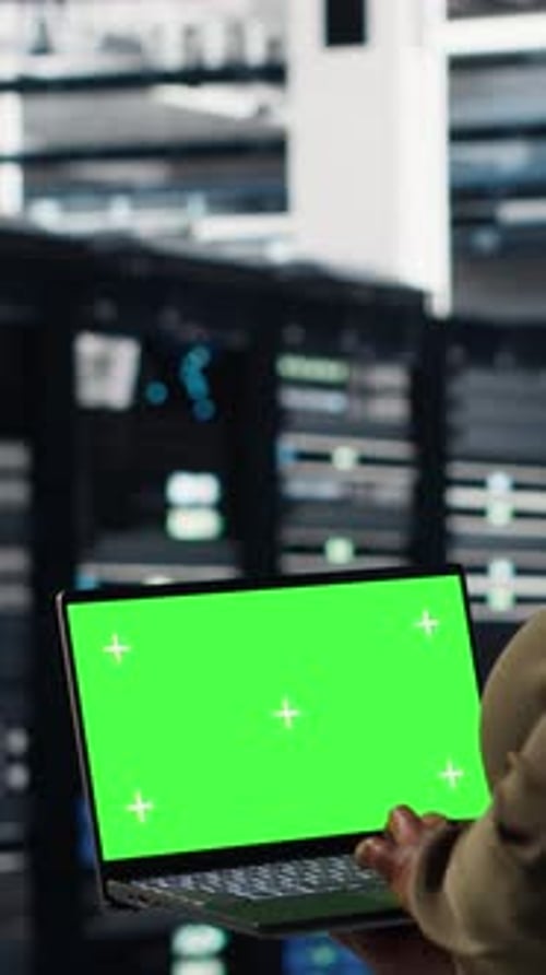 Vertical Video Server Room Admin Uses Green Screen Laptop to Upgrade Mainframes