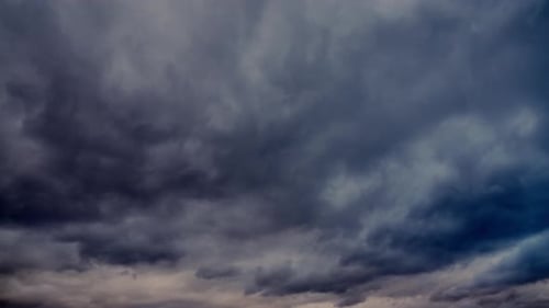 Dark Storm Clouds Swirl Across the Sky