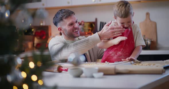 Boy And Dad Play And Fool Around While Baking Cookies, People Stock ...