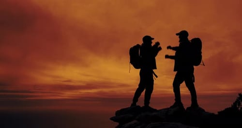 Backpackers Celebrate Hiking Achievement at Sunrise