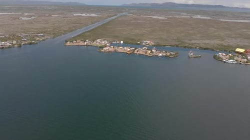 Yellow reed tourist boat at floating village on Lake Titicaca, Peru