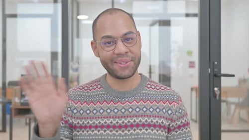 Portrait of Mature Man Waving Hand to Welcome