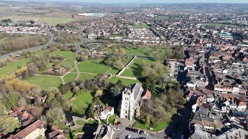 Waltham Abbey town Essex UK pull back drone aerial reverse reveal