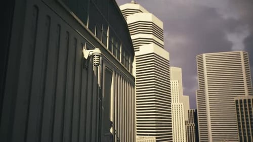 Sunset Illuminates Ornate Columns Against Sleek City Glass Facades