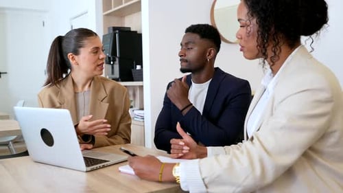 Businesspeople discussing strategy during office meeting