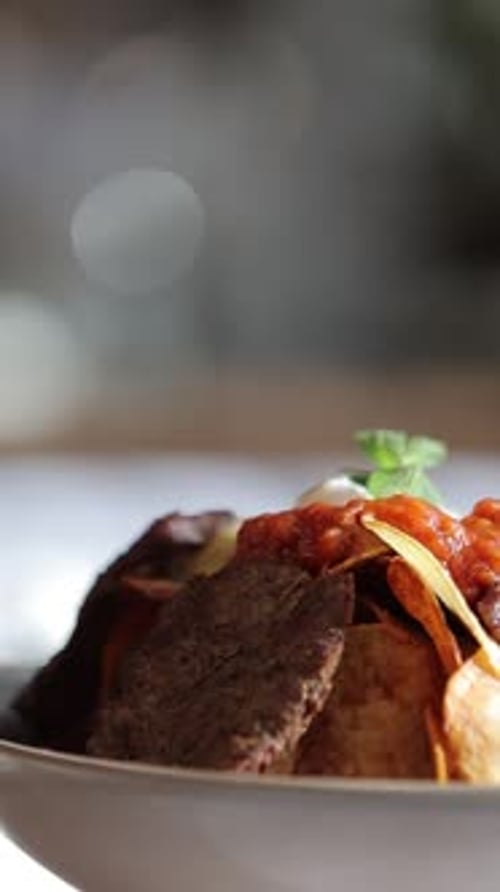 Delicious Dish of Roasted Potatoes and Sliced Meat