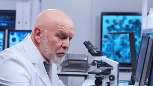 Mature Scientist Analyzing DNA in Modern Lab