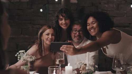 Newlyweds Taking Photo With Parents
