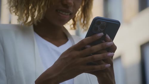 Businesswoman Typing Message on Smartphone Close Up Outdoors