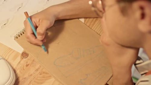 Sketching a Shoe Design in a Sketchbook