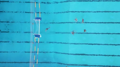 Top View of Water Polo Training Session in a Swimming Pool Players Practicing Near the Goal with