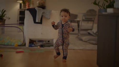 Adorable Infant Learning to Walk at Home