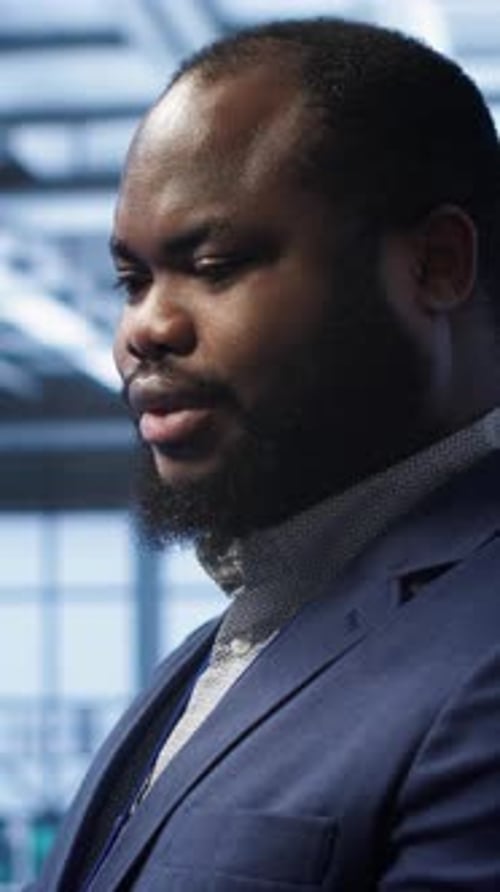 Vertical Video Admin in Server Farm Using Laptop to Patch Network Issues Close Up