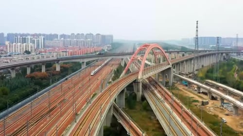 Footage Of Modern High Speed Express Train Pulling Into A Mainline Railway Station At Rail Line Stat