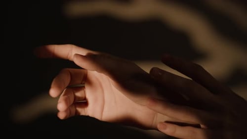 Close-up of Hands of Unknown Young Woman Making Soft Movements