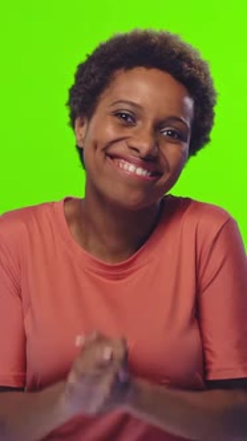 Excitement and Joy in Front of a Bright Green Background