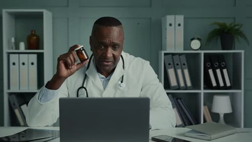 Male Doctor Explains Medication During Video Call
