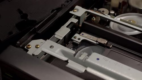 Close Up VHS Video Cassette Insert in Recorder in VCR Player