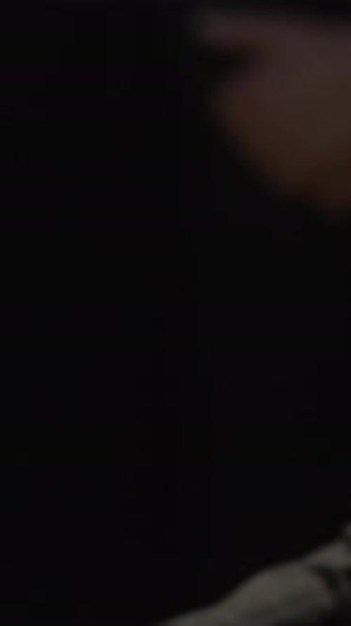 Hands and Profile of Woman Wearing Veil