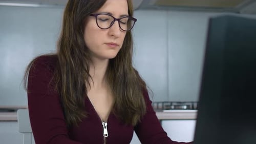 Young Woman Exhausted From Working at Home Massages Dry Irritated Eyes and Removes Glasses Due to