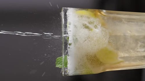 Barman Pouring Soda Water While Making Cocktail at Night Club or Pub Slow Motion Vertical Footage