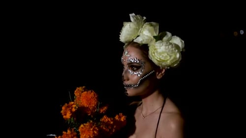 Glamorous Woman With Skull Makeup Holds Flowers