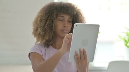 Young Woman Using Tablet at Home