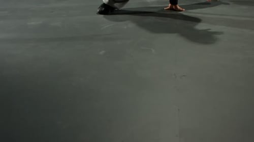 Man Doing Breakdance Moves on Grey Floor