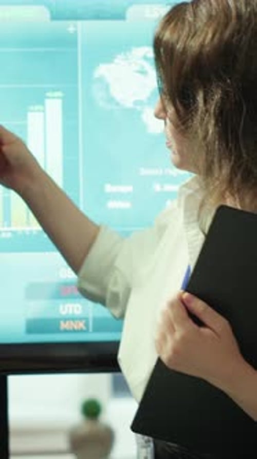 Vertical Video Team of Business Colleagues Study Feedback on Projects for Future Improvements