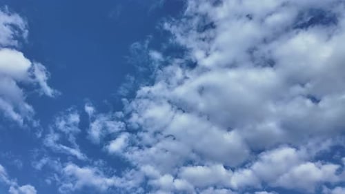 Clouds Moving Slowly Across a Brilliant Blue Sky