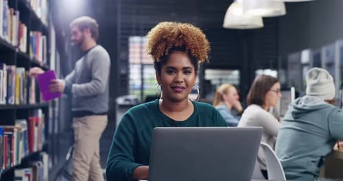 4k video of a student using her laptop in a college library