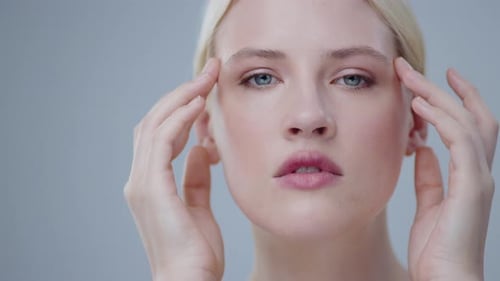 Beautiful Woman Touching Face for Skincare