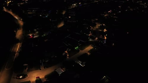 Aerial top down shot of american housing area at night. Lighting Buildings and streetlights. Florida