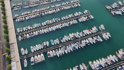 Аerial view with yachts and boats parked in rows in a marina