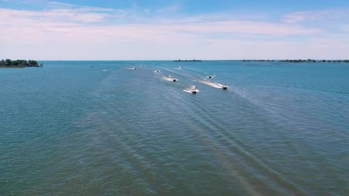 Powerboats and Jet Skis Racing on Water