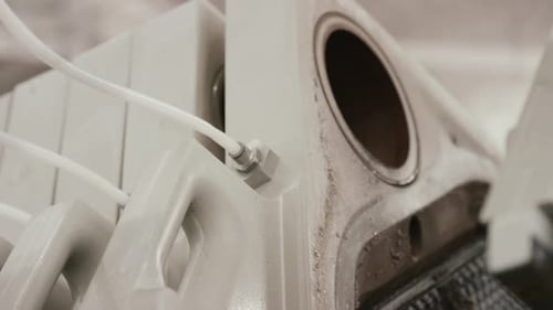 Close Up of Machine With White Tubes