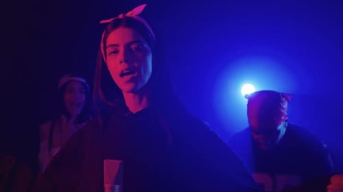 Young Singer Performing Live with Her Crew in Slow Motion