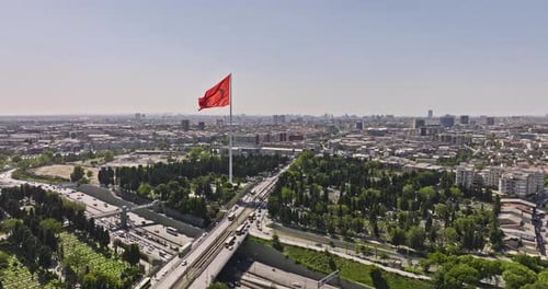 Aerial View of Cityscape with Flag and Highway