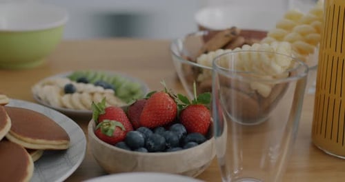 Breakfast foods and drink on a kitchen table