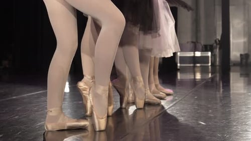 Ballet Dancers Feet on Stage in Pointe Shoes