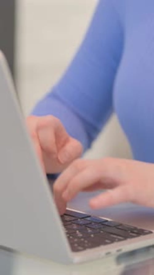 Close up of Female Hands Typing on Laptop, vertical video
