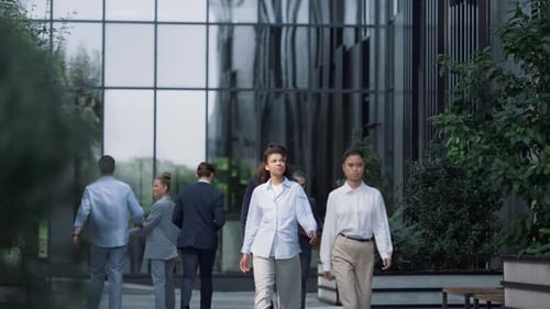 Corporate People Walking Downtown District on Sunny Day. Finance Company Workers. Focused