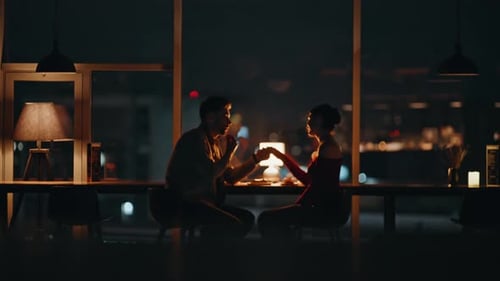 Romantic Man Holding Hand Beloved Woman at Night Date in Luxury Restaurant