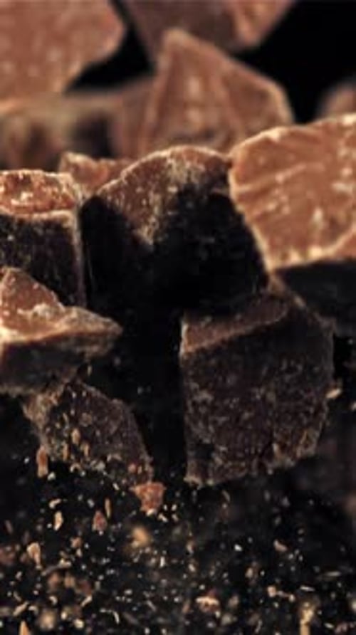 Chunks of Chocolate Fly Up and Fall Down Filmed on a Highspeed Camera at 1000 Fps