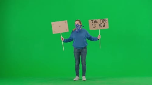 Woman Holds Protest Signs on Green Screen