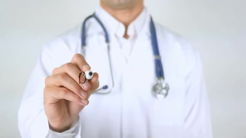 Doctor Writes the Word Deficiency on Glass